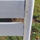 pair of white metal chairs, Tolix style