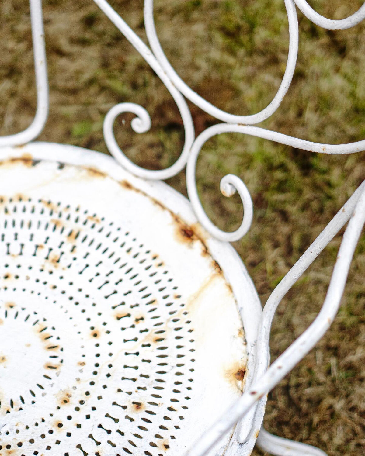 Duo of wrought iron armchairs