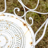 Duo of wrought iron armchairs