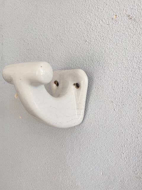 Enamelled earthen coat hook, 1900