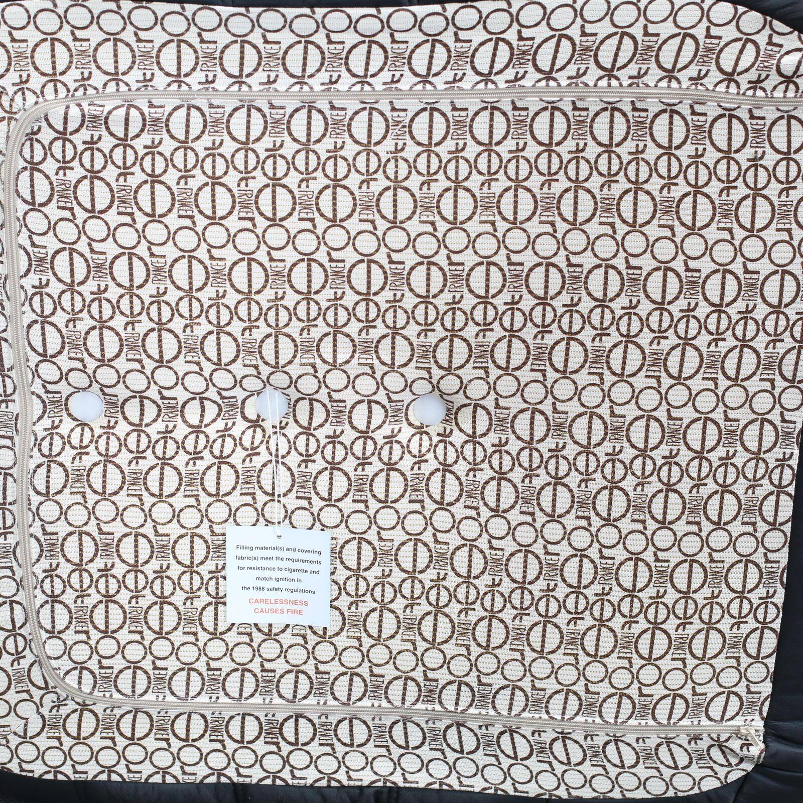 Togo armchair and footrest in black leather by Ligne Roset, designed by Michel Ducaroy.