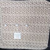 Togo armchair and footrest in black leather by Ligne Roset, designed by Michel Ducaroy.