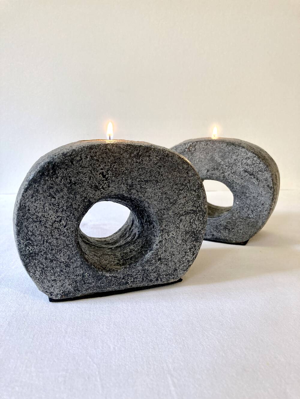 Pair of terracotta candle holders with anthracite finish, 1980s.