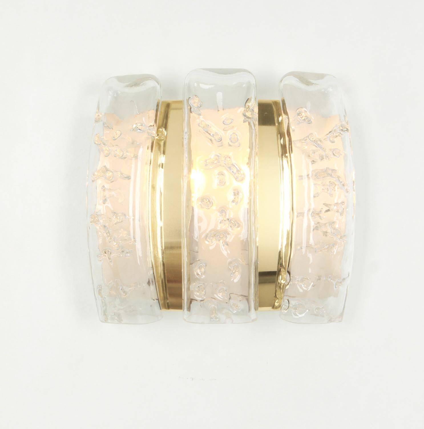 Pair of wall sconces in brass or ice glass by Doria, Germany, 1960s.