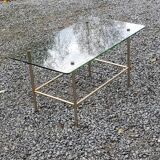 Vintage coffee table in gold and blackened metal with glass top from the 60s