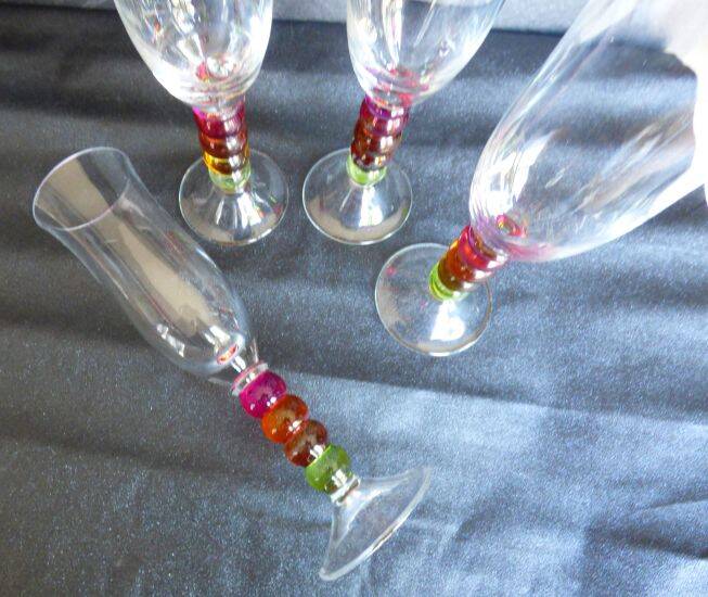 4 vintage flutes with coloured glass stems