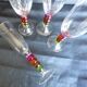 4 vintage flutes with coloured glass stems
