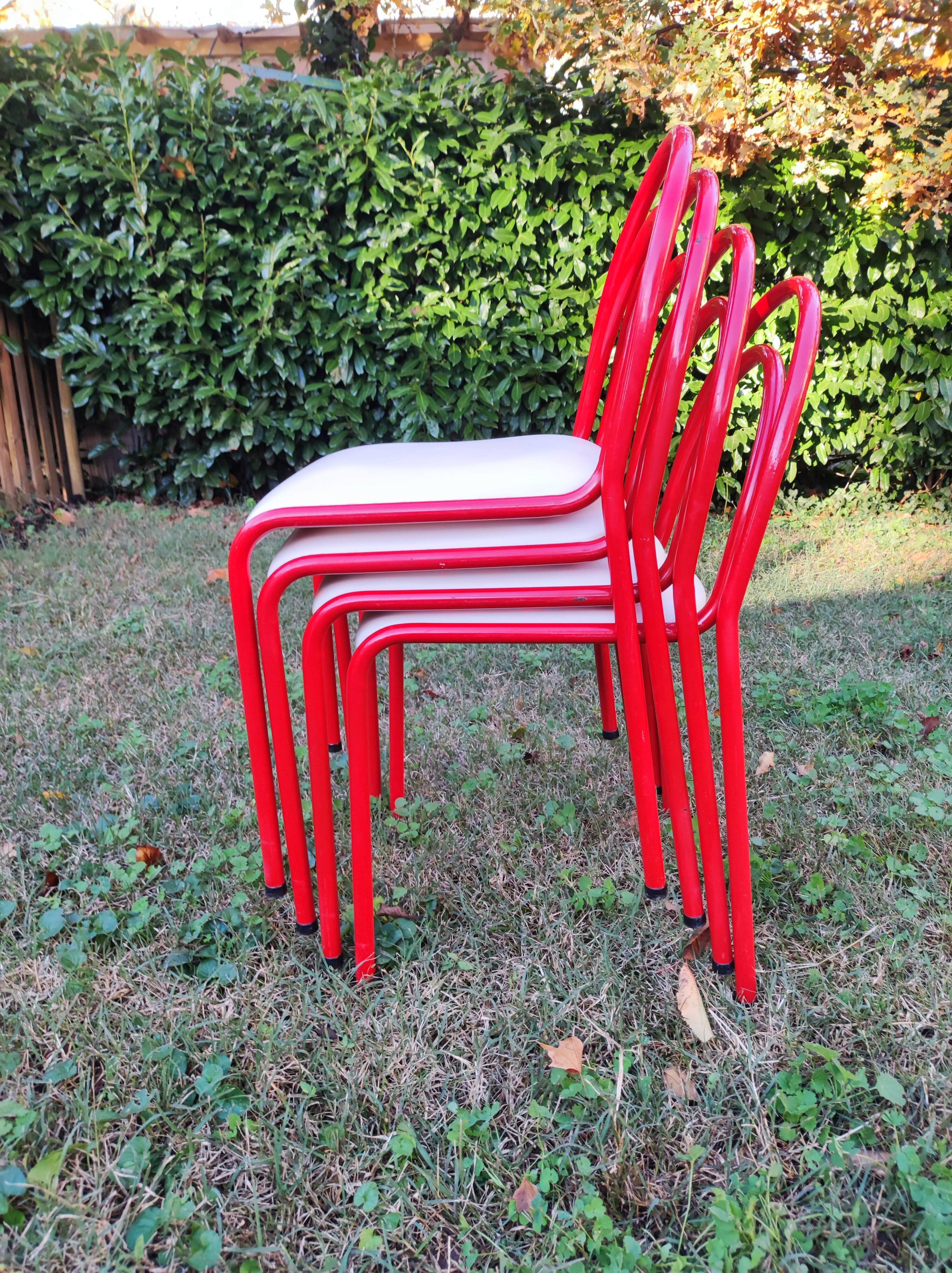 Stackable chairs, Italy, 1980s, red metal, white vinyl