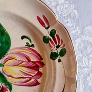 Earthenware plate from St Clément with tulip decoration.