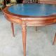 Elegant game table or circular extending side table in Louis XVI style.