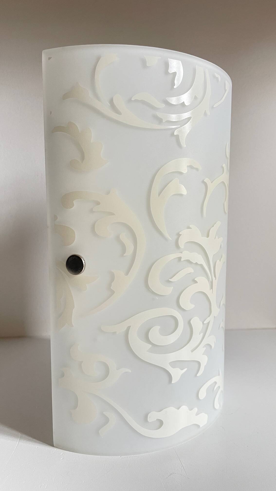 Polished and screen-printed glass sconce by eglo