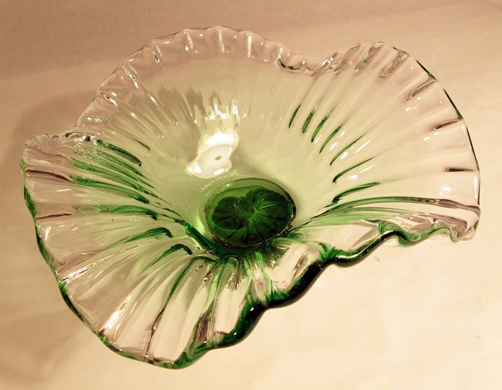 Glass cup on decorated metal stand