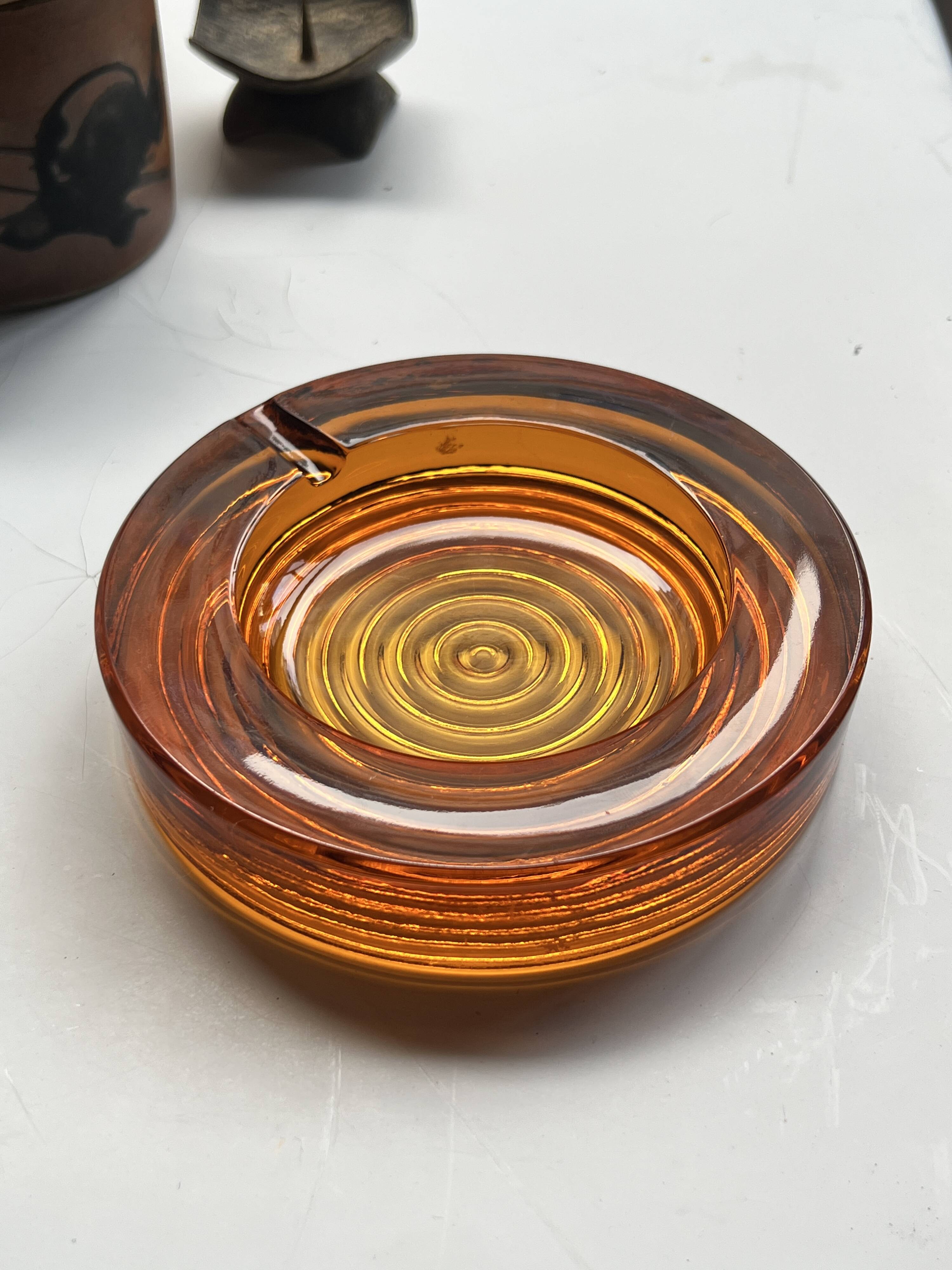 Amber pressed glass ashtray, 1970s design.