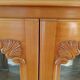 Showcase with shell mouldings in wood, glass, and mirror.