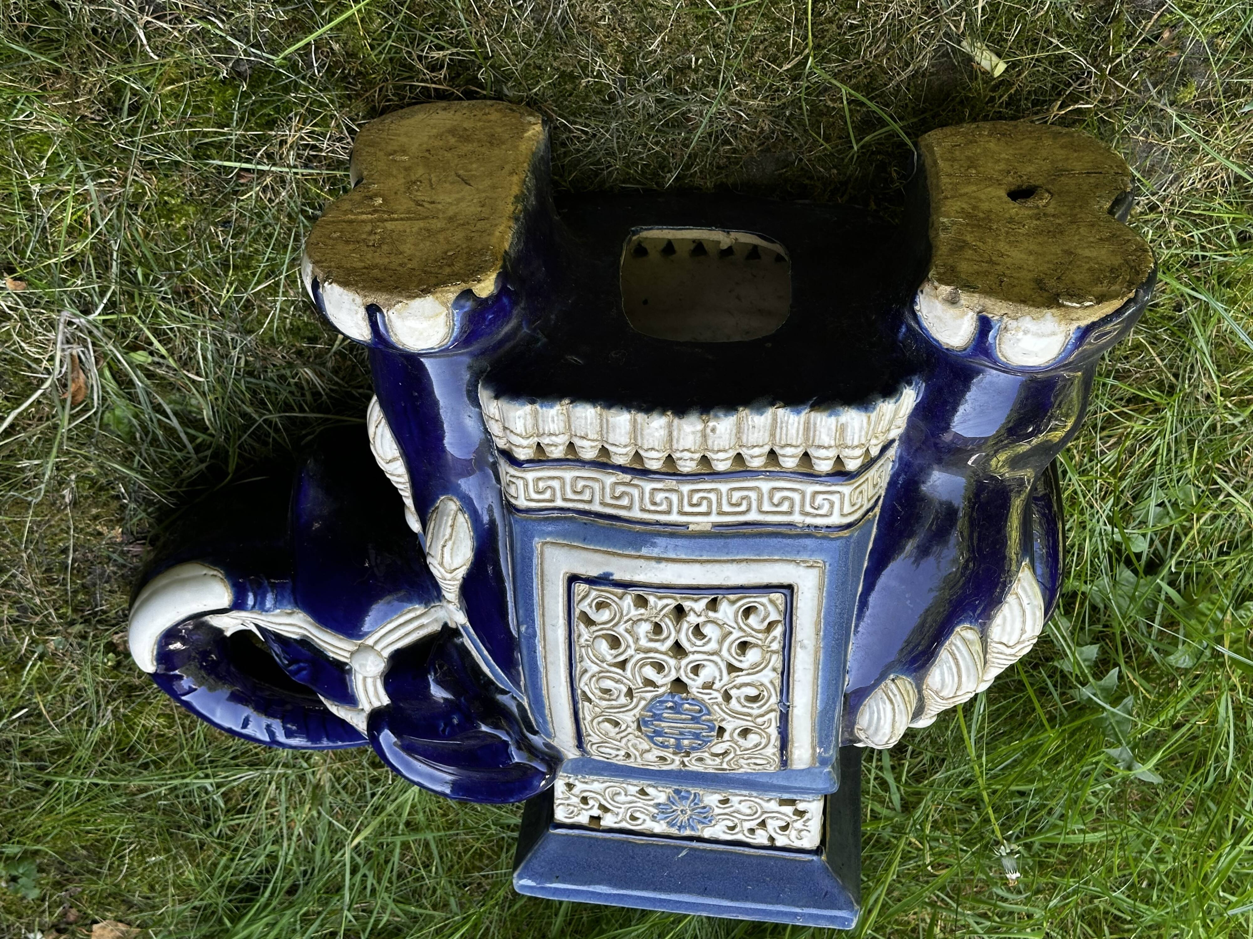 Elephant stool in glazed ceramic in cobalt blue and ivory colors