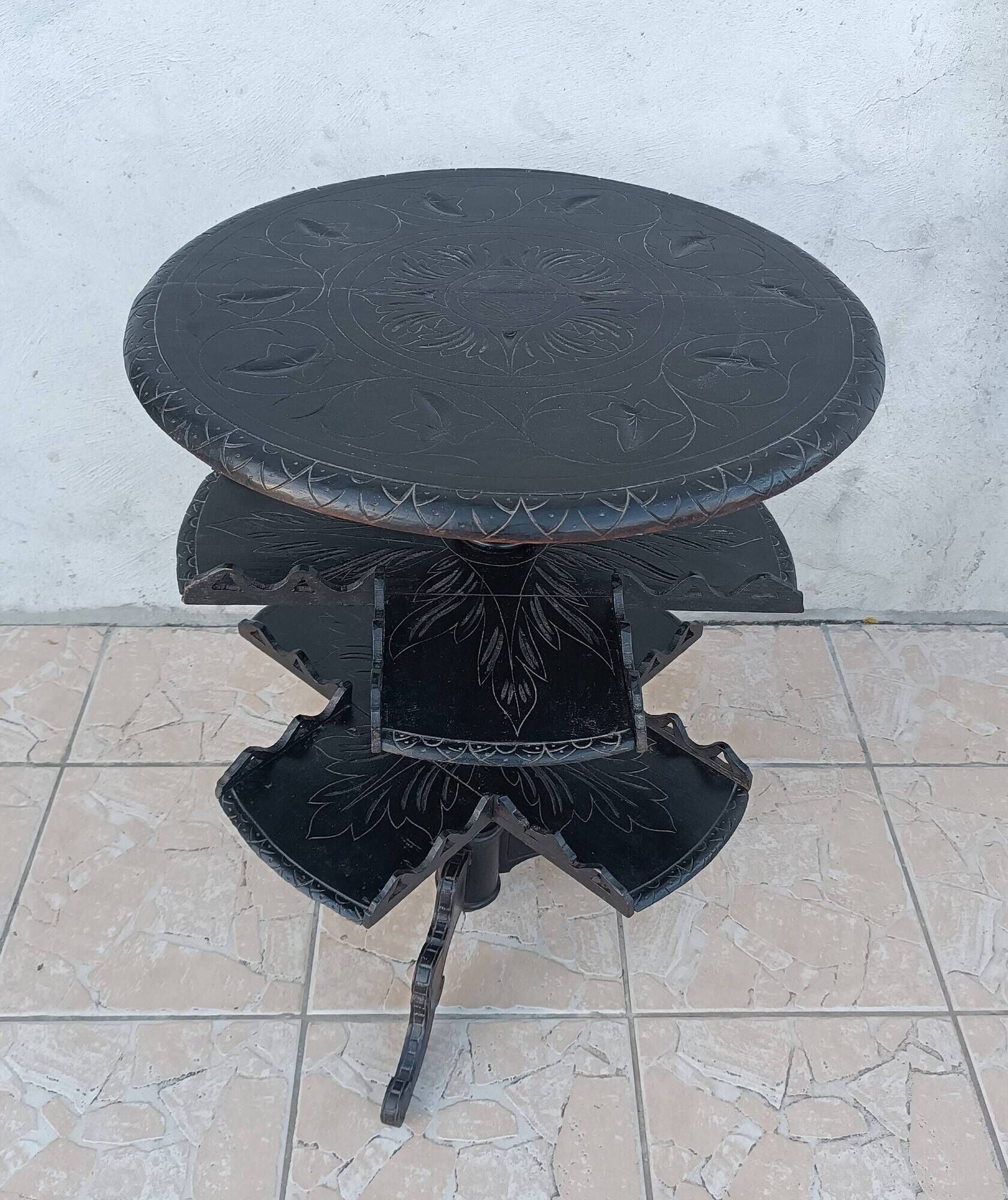 Napoleon III period gueridon in blackened wood.