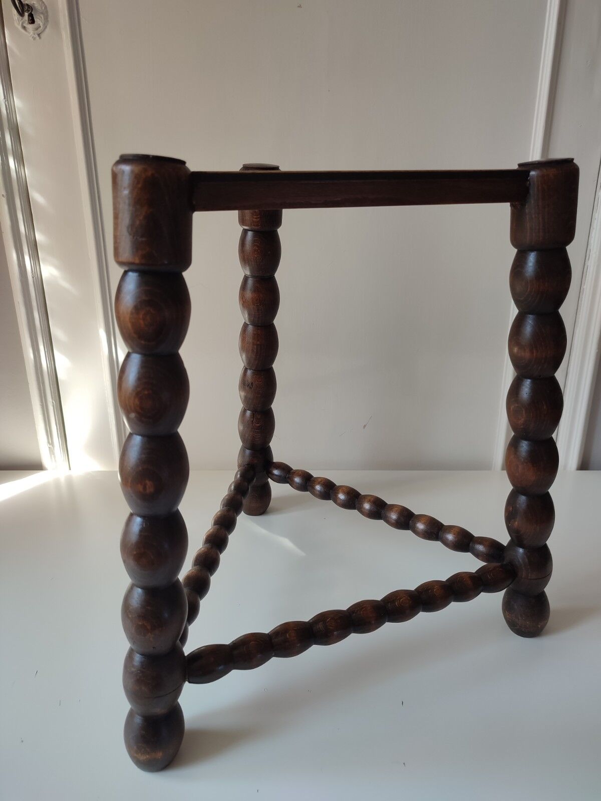 Wood tripod sofa end