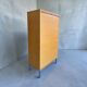 Classeur, armoire à rideaux roulant vintage en bois sur pieds chromés