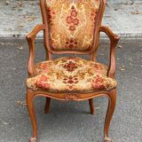 Louis XV armchair in carved solid wood and red and yellow fabric