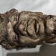 Head of satire in plaster