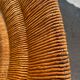 Vintage armchair in straw and brutalist wood