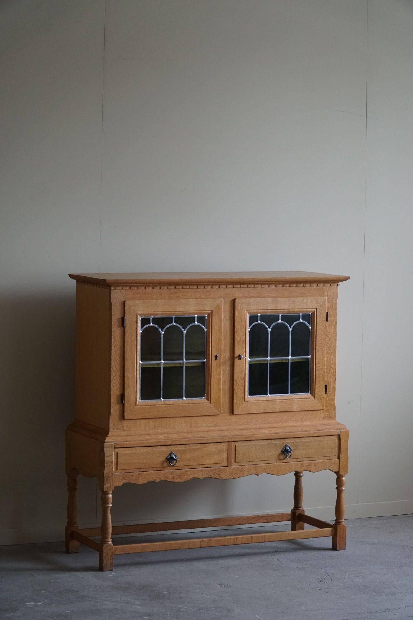 20th-century solid oak display cabinet with a glass front, by a Danish cabinetmaker.