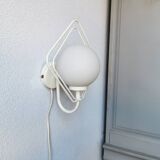 Metal applique with 80s glass sphere