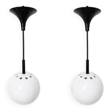 Two white metal globe pendant lights, 1970s.