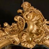 Large oval mirror in gilded wood