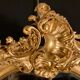 Grand miroir ovale en bois doré