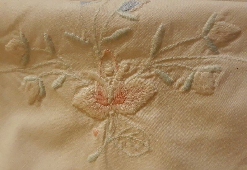 White tablecloth embroidered with lace & days