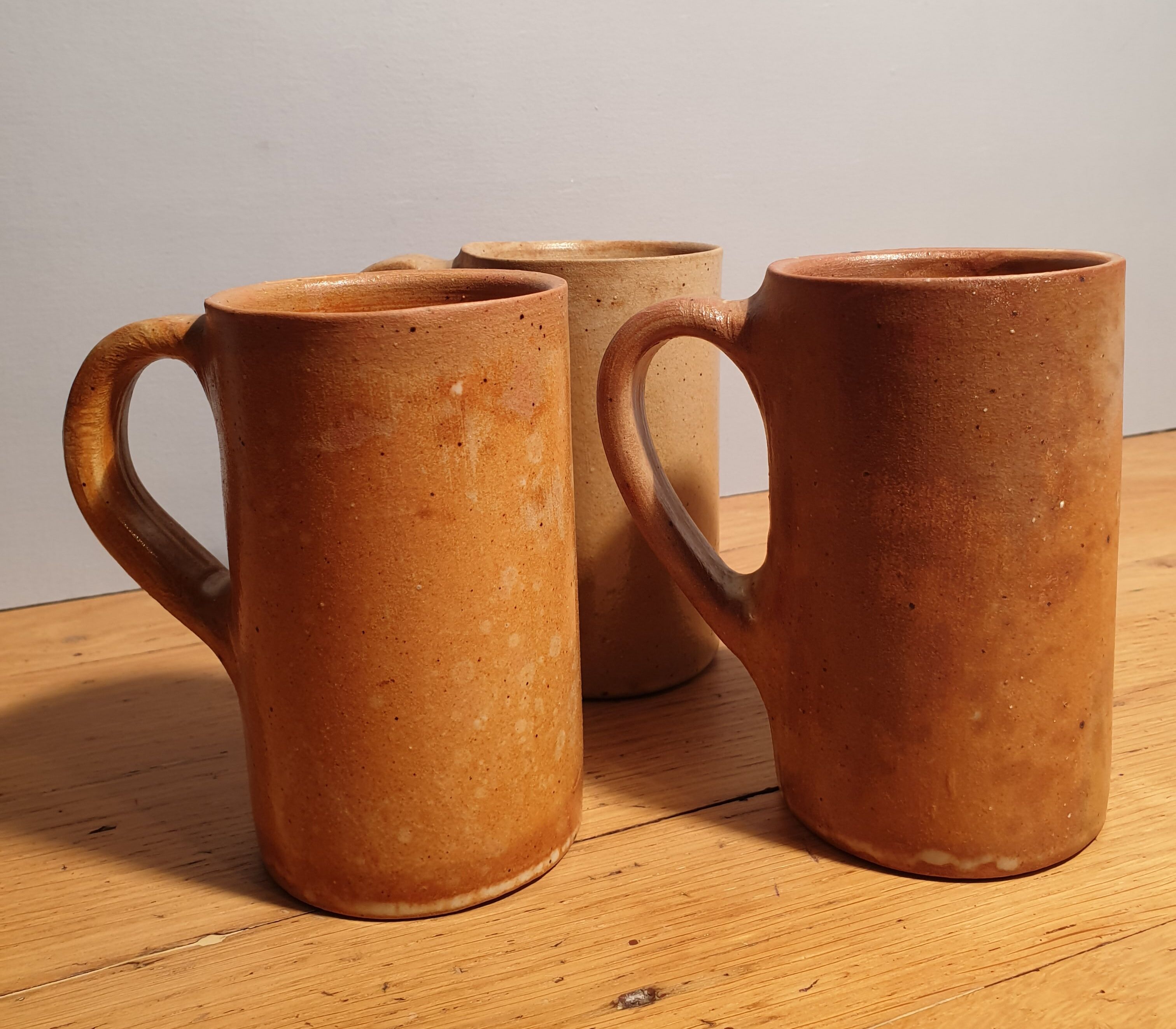 Set of three large sandstone mugs