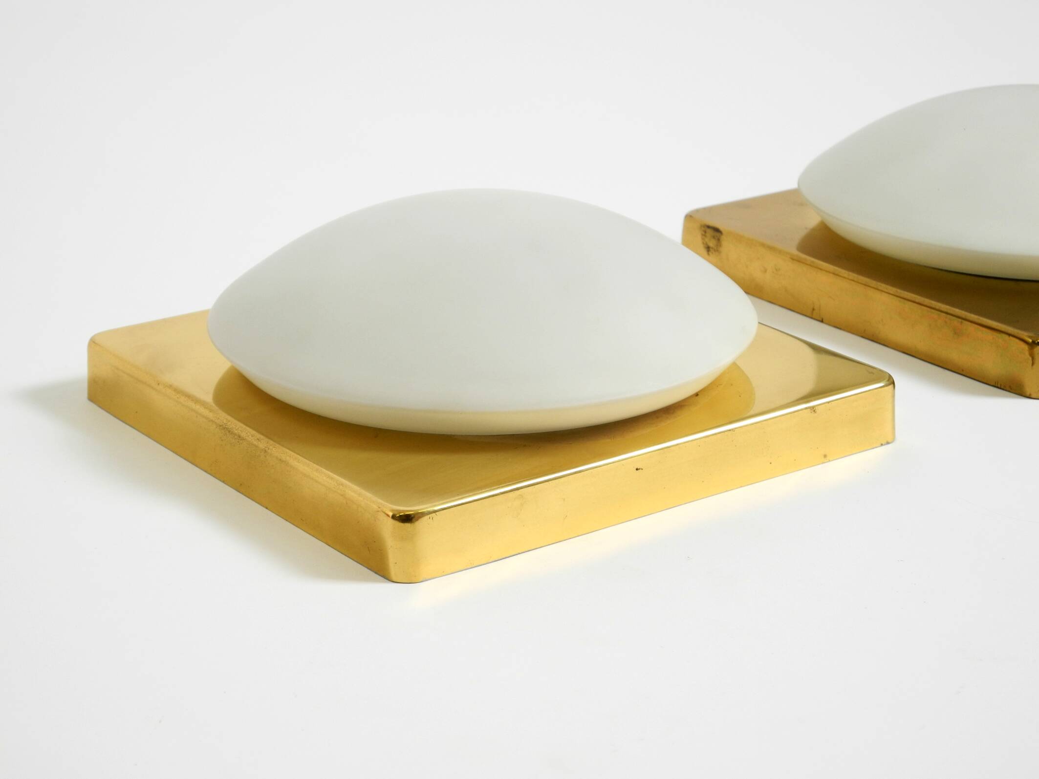 Two 1970s brass wall lamps by Rolf Krüger for Heinz Neuhaus Leuchten