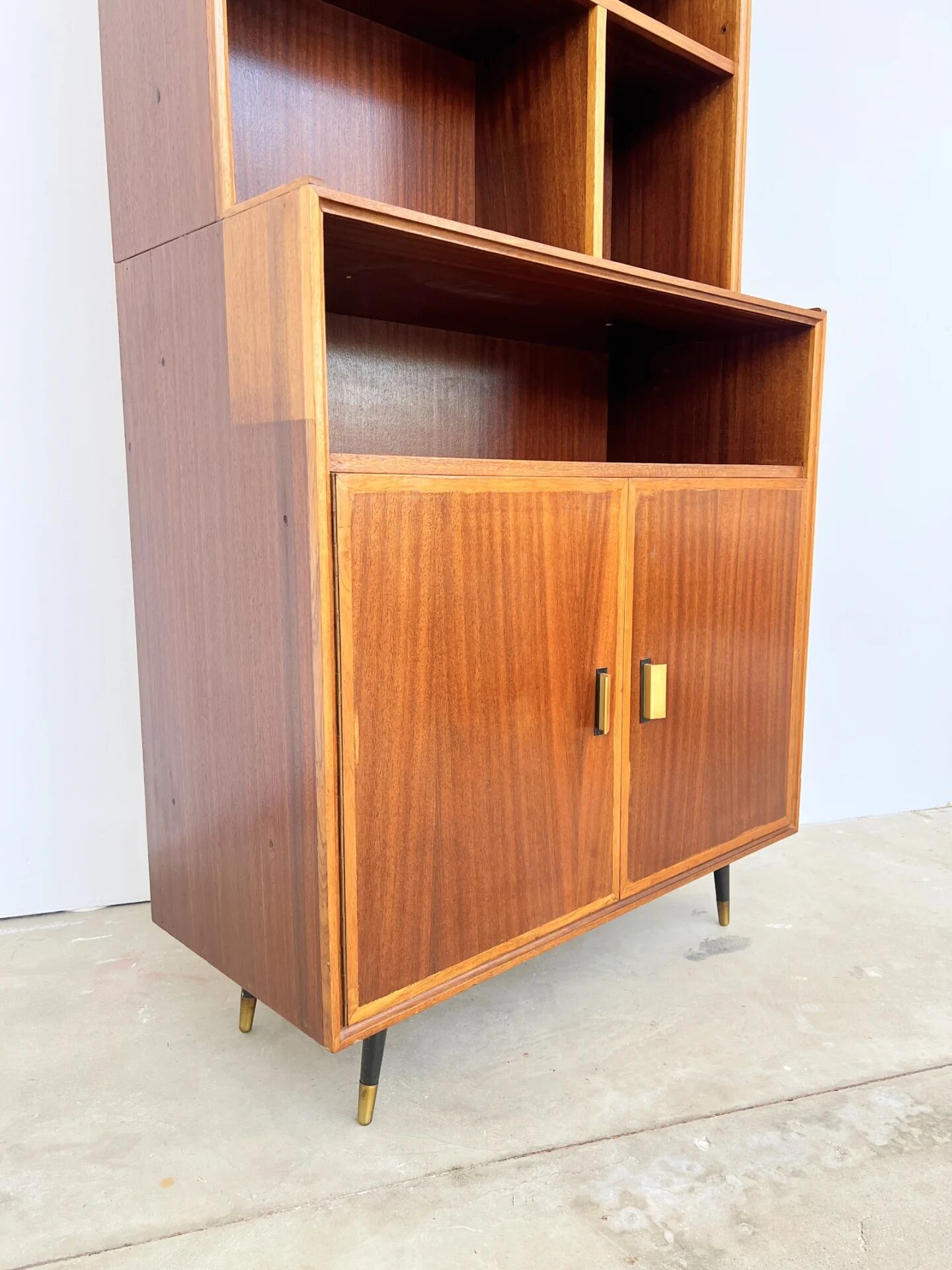 Mahogany library — closed storage and open cubbies, custom-made, 1960s.