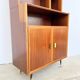 Mahogany library — closed storage and open cubbies, custom-made, 1960s.