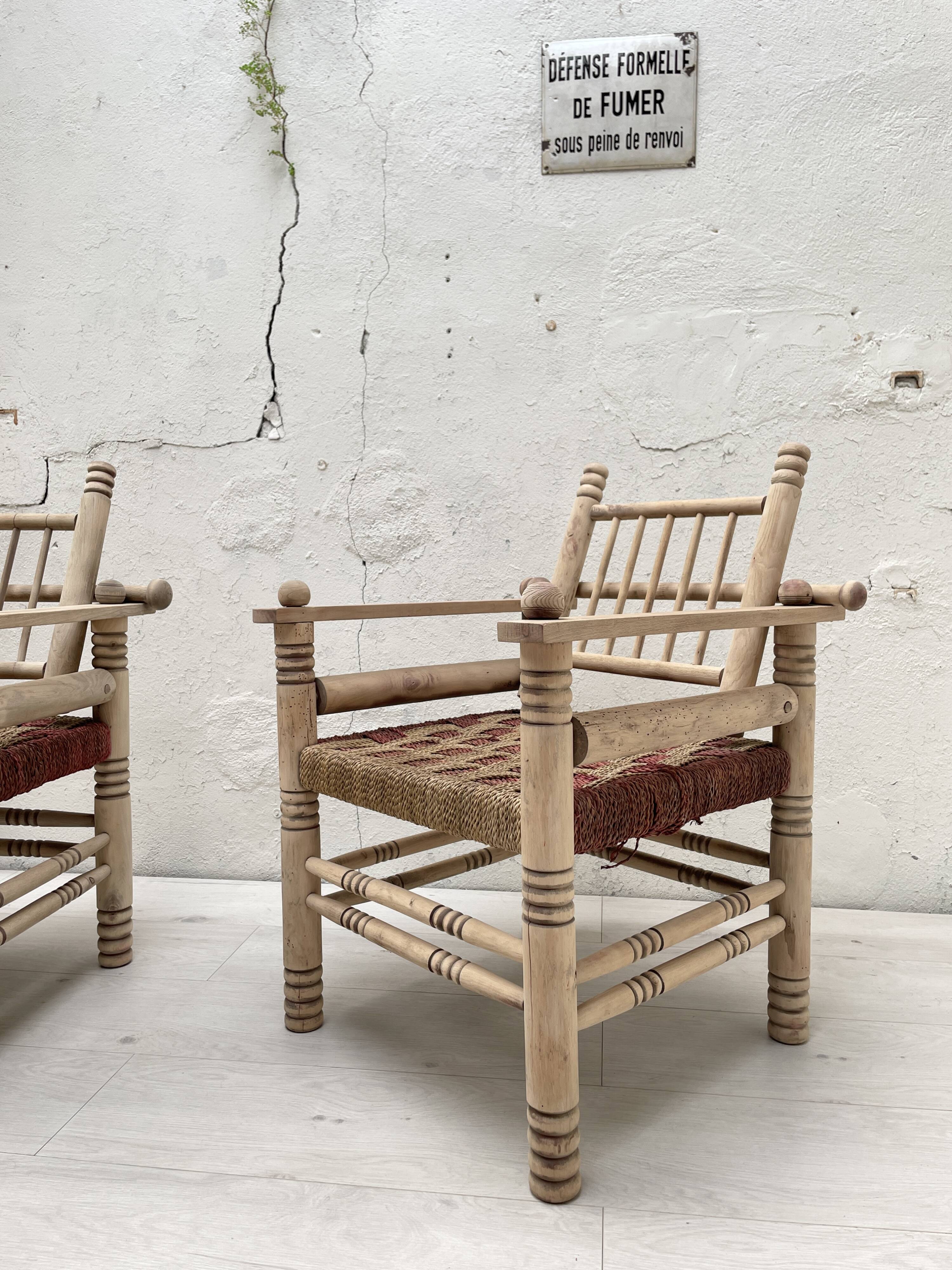 Pair of wooden armchairs and ropes
