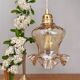 Suspension tulipe vintage en verre ambré