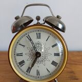 Vintage brown and silver mechanical alarm clock