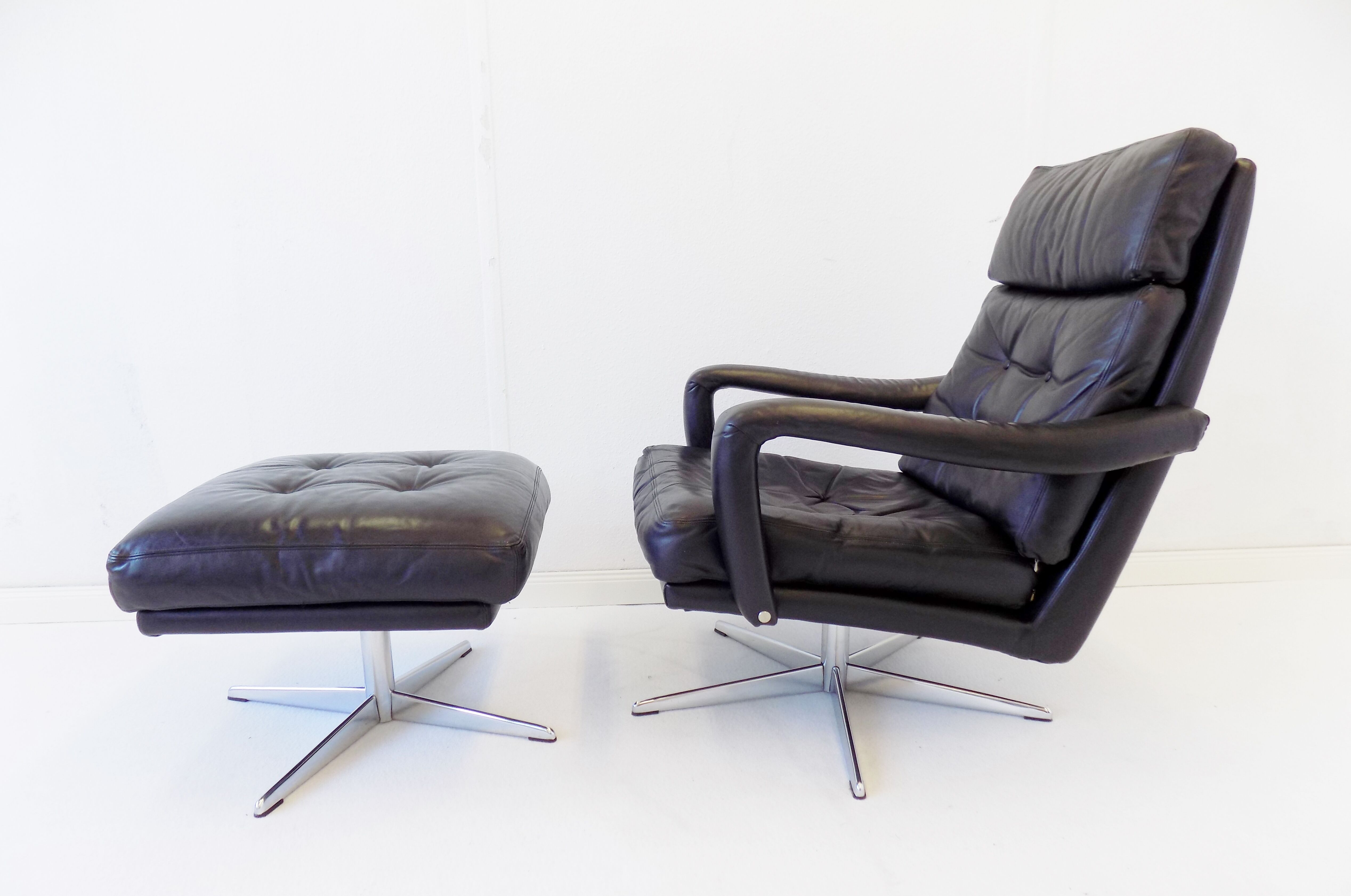 Danish black leather armchair with ottoman 70s