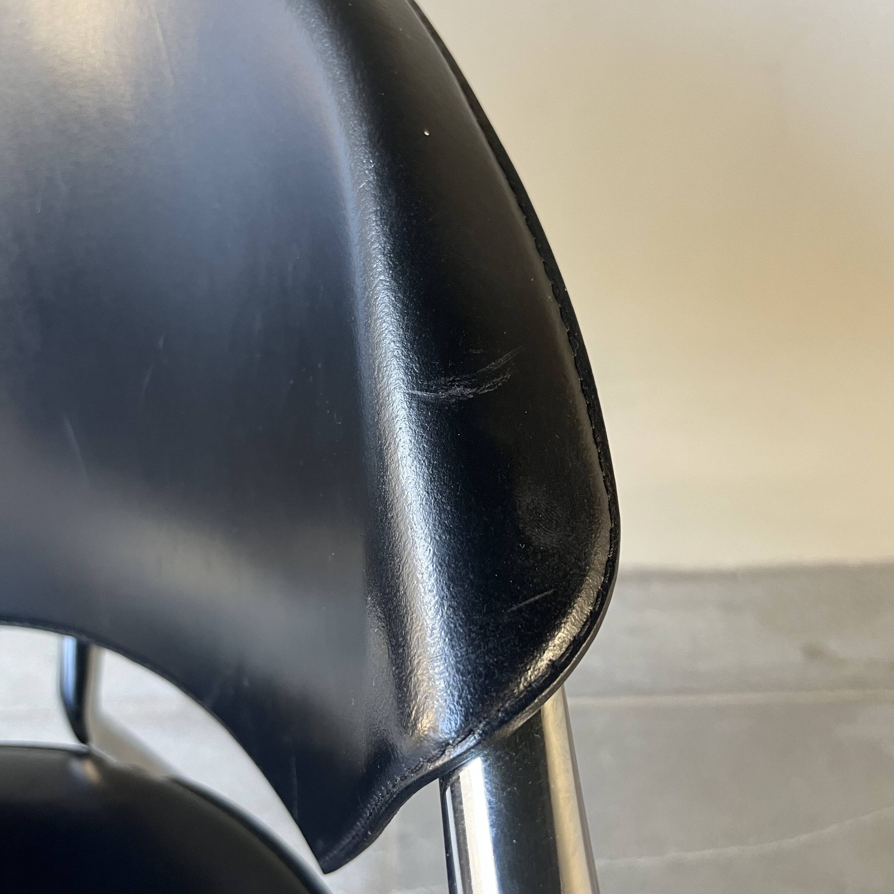 Set of four Italian black leather chairs, 1970