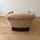 Vintage 1970s armchair in beige fabric with fringes.