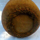 Demijohn dressed in burlap and padded cork