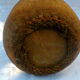 Demijohn dressed in burlap and padded cork