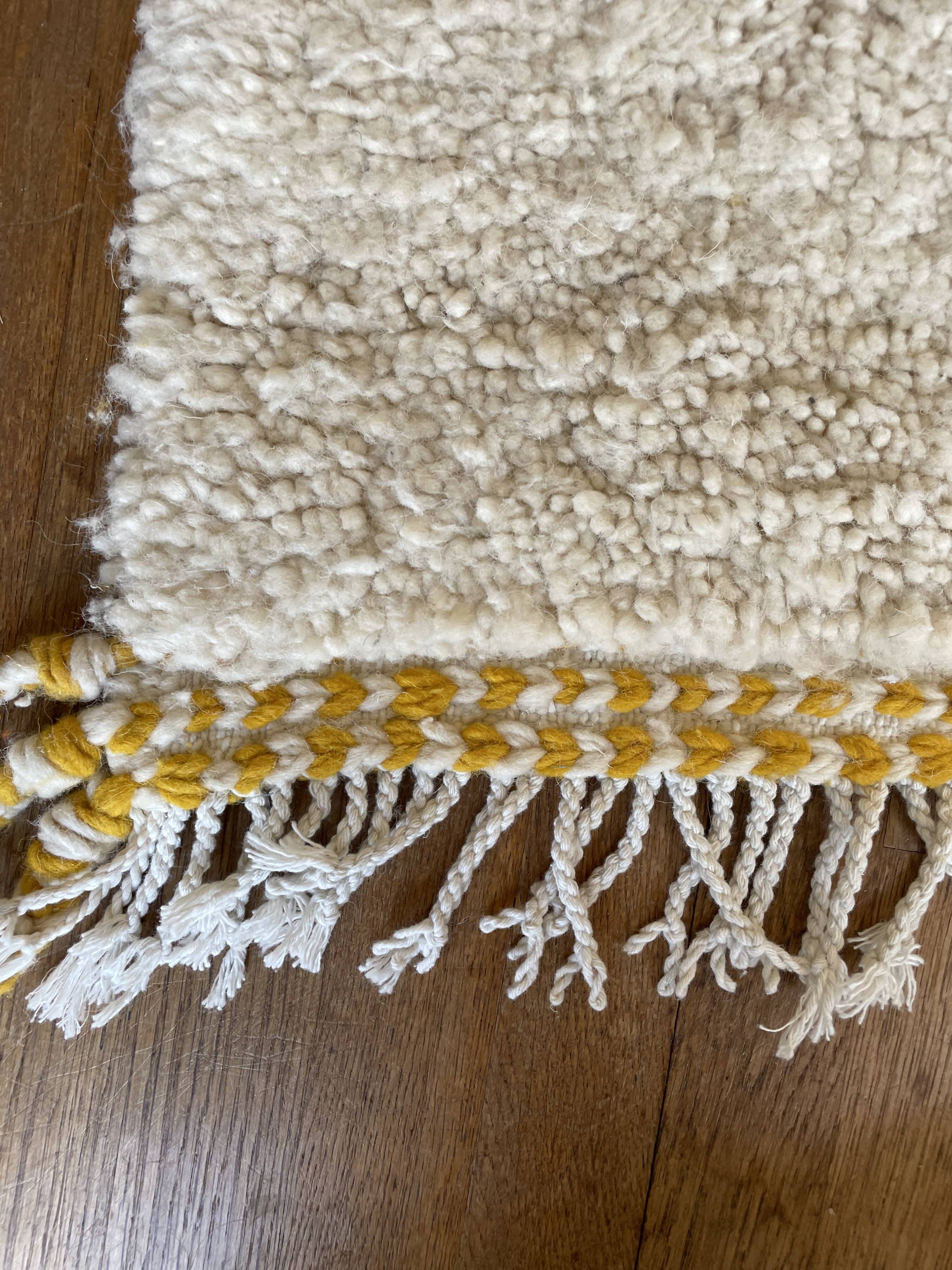 Berber carpet béni ouarain modern white with abstract patterns mustard yellow and blue majorelle