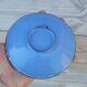 Decorative plate in blue enameled metal with bird motifs