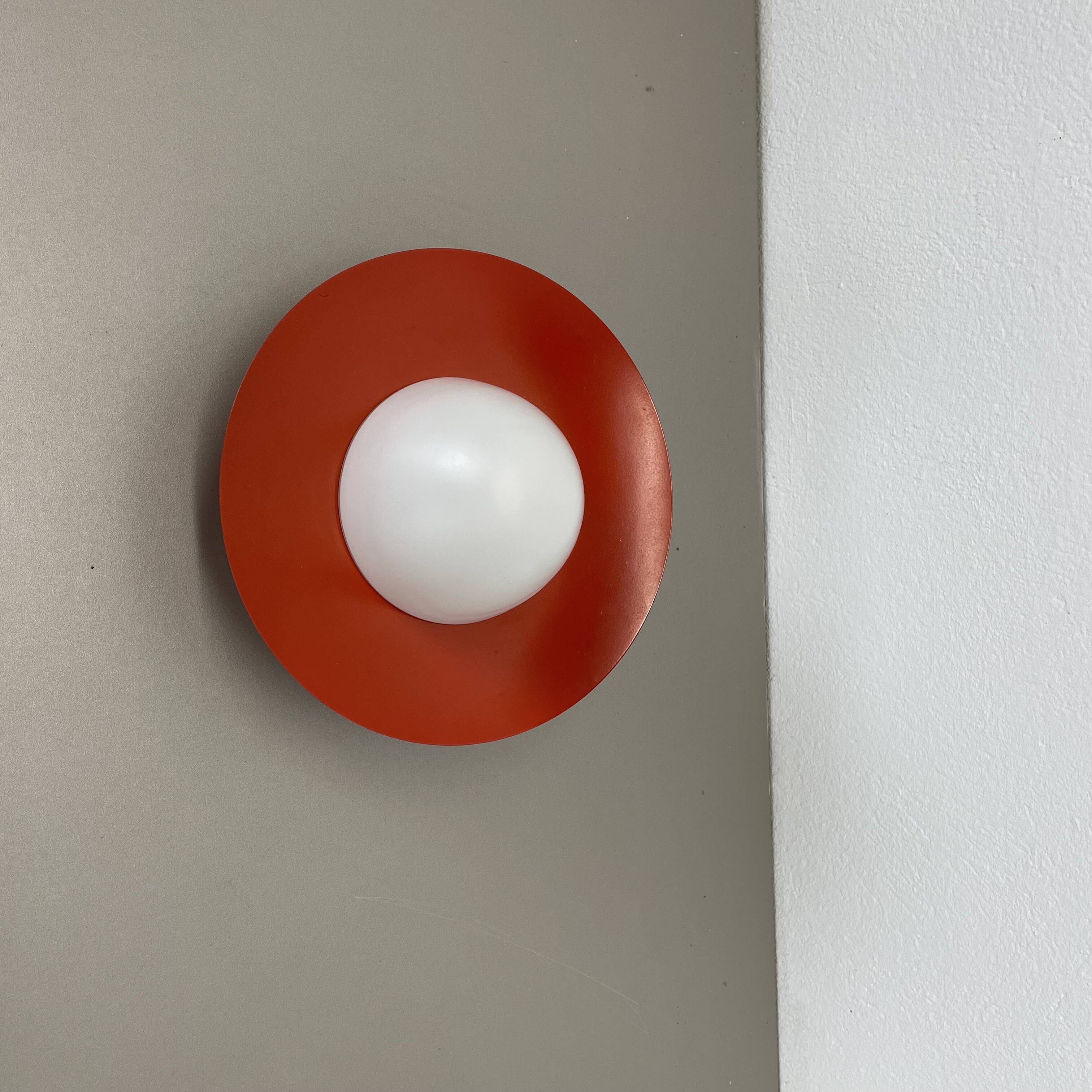 Round red wall light in metal and opaline glass in the Stilnovo style, 20 cm, Italy, 1960s