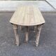 Round extendable dining table with flaps, stripped in raw oak, with 3 extensions.