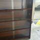 Vintage 1960s wooden library with sliding doors.