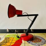 Old articulated desk lamp in red metal