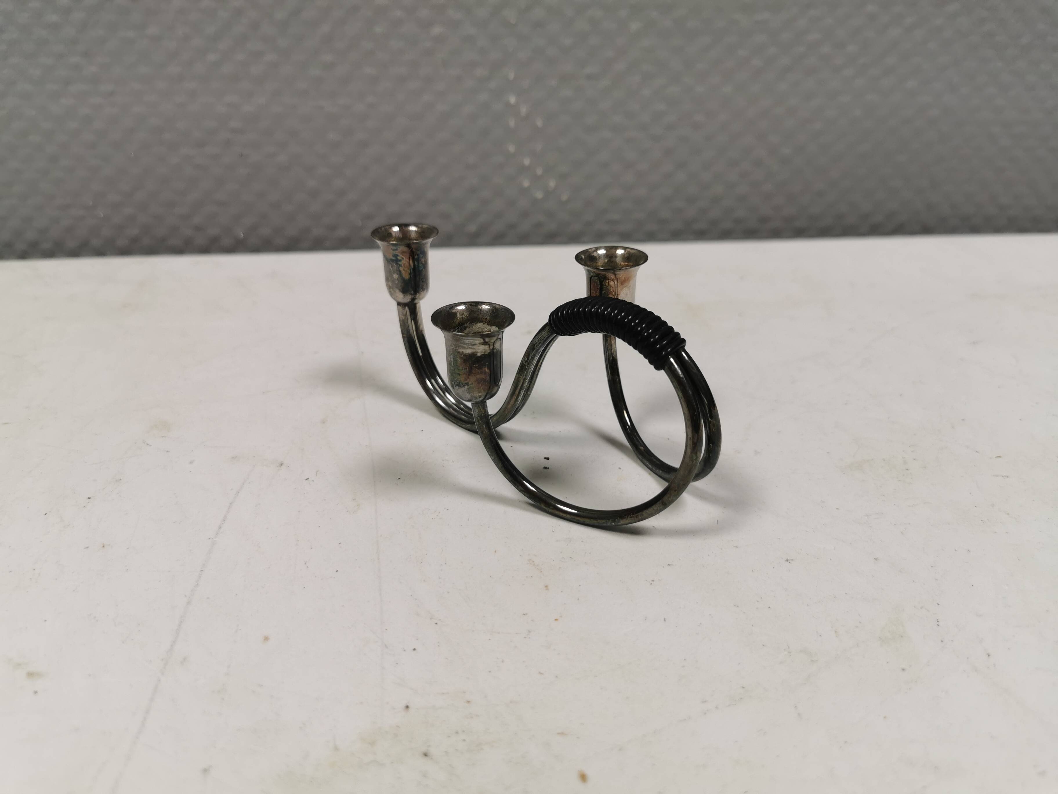 Small candle holder in tarnished silver, with place for three small candles